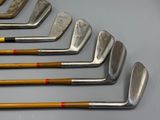 six different types of golf clubs lined up on top of each other