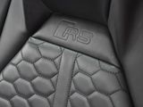 a close up of a seat in a car with a logo on it