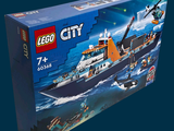 a lego city boat in the box on the table