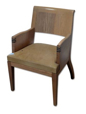 a wooden chair with a tan seat on a white background