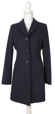 the coat is made of wool and has buttons on the front