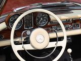 steering wheel and dashboard of a classic car with wood paneling