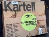 a cardboard box with a sticker on it that says kartell