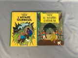 two books that are sitting on a table