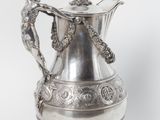 an image of a silver vase with a handle on a white background
