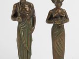 pair of bronze figurines of a woman and a man