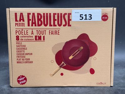 packaging of a red bowl with a wooden spoon on top of it