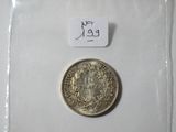 an image of a silver coin with a tag on it