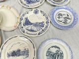 many plates that are sitting on a table