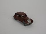 a toy car that is sitting on a white surface
