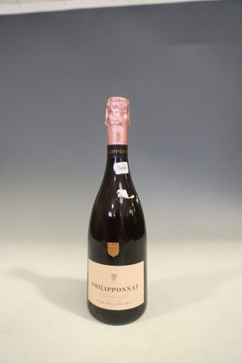 a bottle of wine that is sitting on a table
