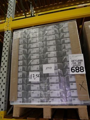 a pallet with a lot of boxes on it in a warehouse