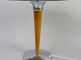 an image of a table lamp on a white surface with a cord plugged to it