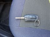 a car key sitting on the seat of a car