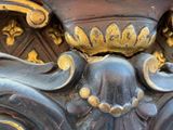 a close up of a vase with gold decoration on it