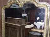 a mirror that is sitting on a table in a room