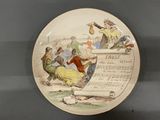 a plate with a picture of a man and a woman on it