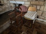 two chairs and a table in the corner of a room