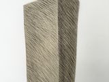 an image of a sculpture of a block of wood on a white surface