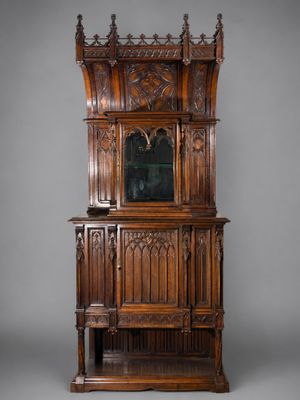 an old wooden cabinet with a mirror on top of it