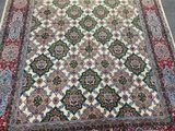 an oriental rug with a red, green, and blue design
