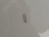 a close up of a white plate with a name on it