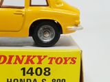 a yellow toy car sitting on top of a box