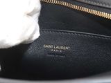 a black purse with a white fur inside of it