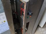 a metal box that has a bunch of wires in it