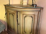 two lamps that are on top of a wooden cabinet