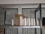 many bottles and containers on the shelves in the room