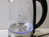a close up of a glass tea kettle on a counter