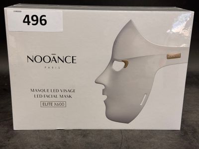 a box with a white mask on it on the floor