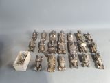 a lot of silver toys that are sitting on a table