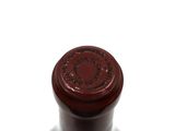 a bottle of wine that is sitting on a table