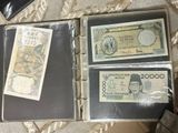 three different types of currency in a binder