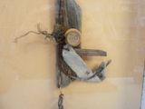 a picture of a wooden object hanging on a wall