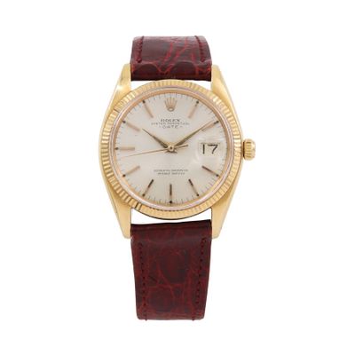 a gold and white wrist watch with a brown leather strap