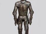 une statue représentant un homme en armure tenant une épée