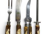four different types of knives and knives are lined up on a white surface