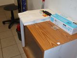 a desk with a box on top of it in a room