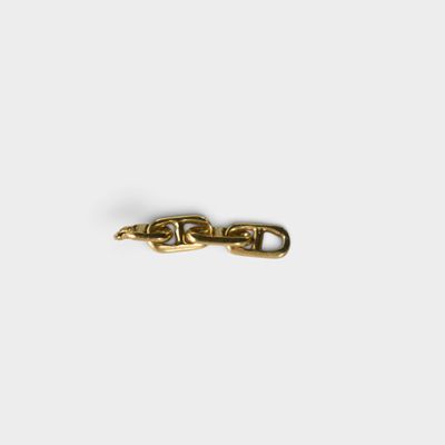 a close up of a gold chain on a white background