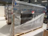 a pallet full of boxes of furniture in a warehouse
