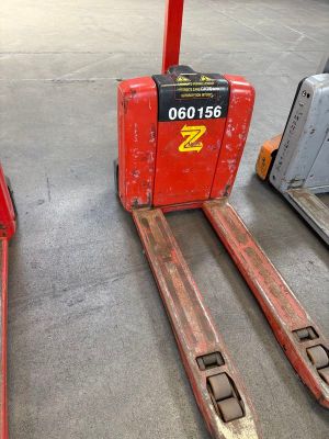 two forklifts sitting next to each other in a warehouse