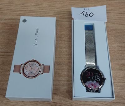 a box with a watch inside of it on a table
