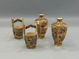 three vases with handles and handles are sitting on a table