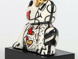 a small statue of a rabbit with a crown on it