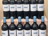 many bottles of wine sitting on a wooden crate