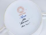 a white plate that has a picture of a woman on it