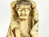 chinese carved ivory figurine of an old man with a hat on his head